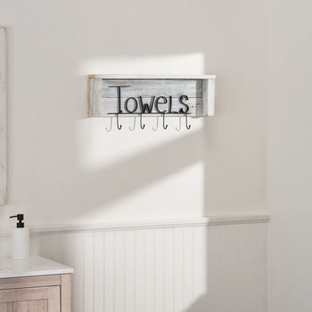 A Towel Rack with Hooks and Shelf mounted on a white wall. The rack has a shelf on top and hooks below, with the word 