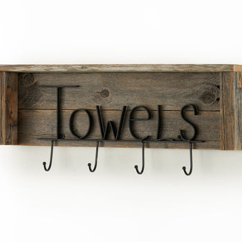 A rustic wooden shelf with a weathered finish has the word 
