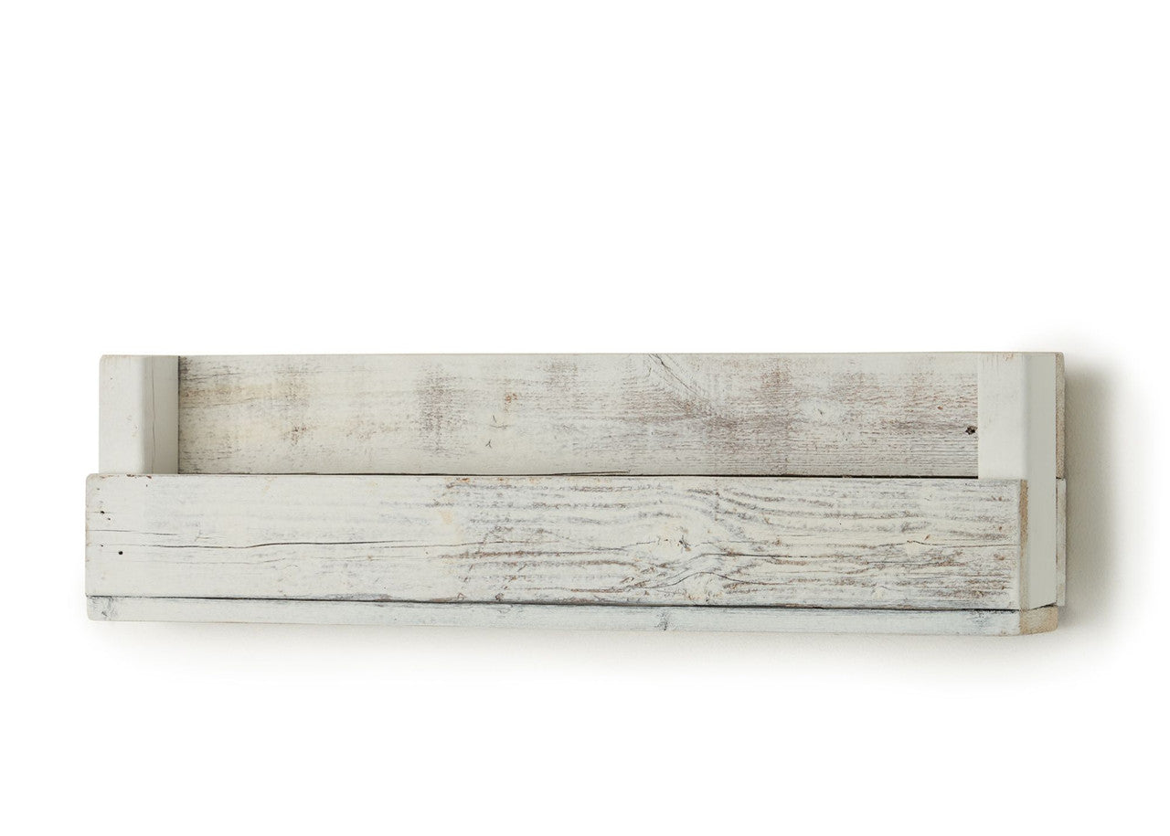 A single floating wood shelf, weathered and painted white, is mounted horizontally against a white background. The shelf has a rectangular shape with a backboard and a slightly recessed bottom shelf, creating a small ledge.