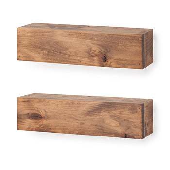Two thick, rustic wooden floating shelves are shown mounted vertically on a plain white wall. The shelves feature a medium-brown finish with prominent natural wood grain and knots, giving them a sturdy, block-like appearance.