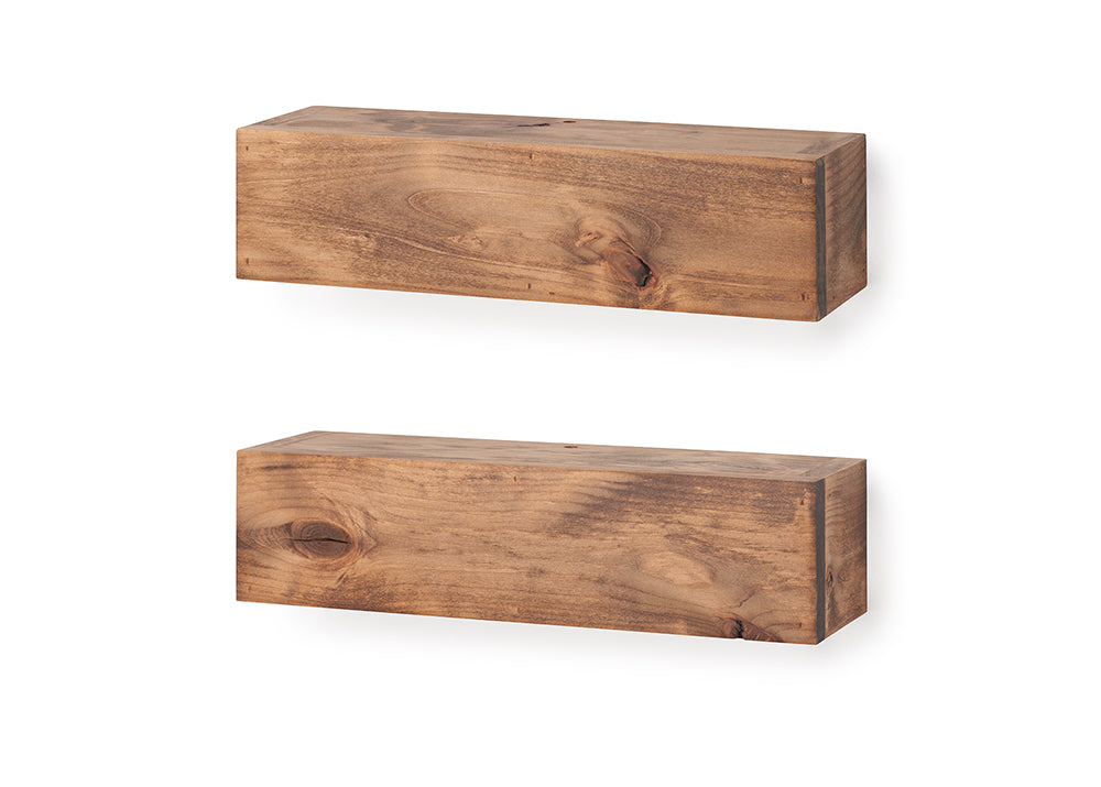 Two thick, rustic wooden floating shelves are shown mounted vertically on a plain white wall. The shelves feature a medium-brown finish with prominent natural wood grain and knots, giving them a sturdy, block-like appearance.