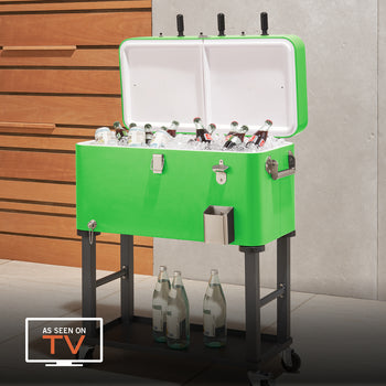 A bright green rolling cooler filled with ice and bottled drinks is shown with its lid open. The cooler features a built-in bottle opener, cap catcher, and is placed on a black metal stand with wheels, making it portable for outdoor use.