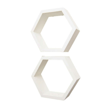 Two white hexagonal wall shelves are stacked vertically with a small gap between them. Each shelf has a modern, minimalist design with clean edges and a hollow center.