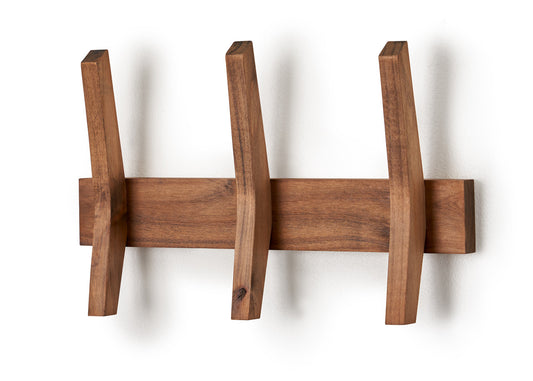 A wall-mounted coat rack made of walnut wood features a horizontal plank with three angled wooden hooks extending outward. The mid-century design offers a minimalist and functional storage solution.