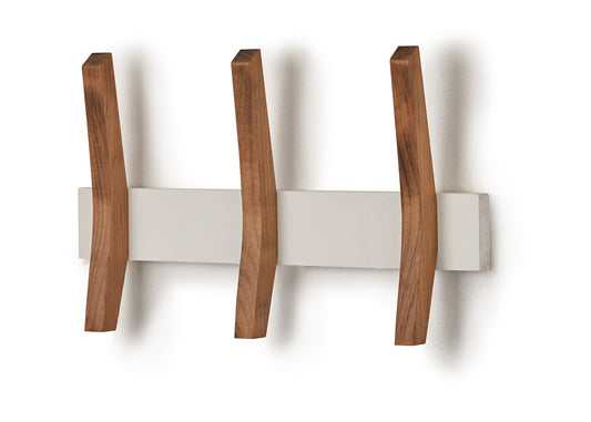 A wall-mounted coat rack features three curved wooden hooks extending from a rectangular white base. The hooks are evenly spaced and cast shadows on the white wall behind them.