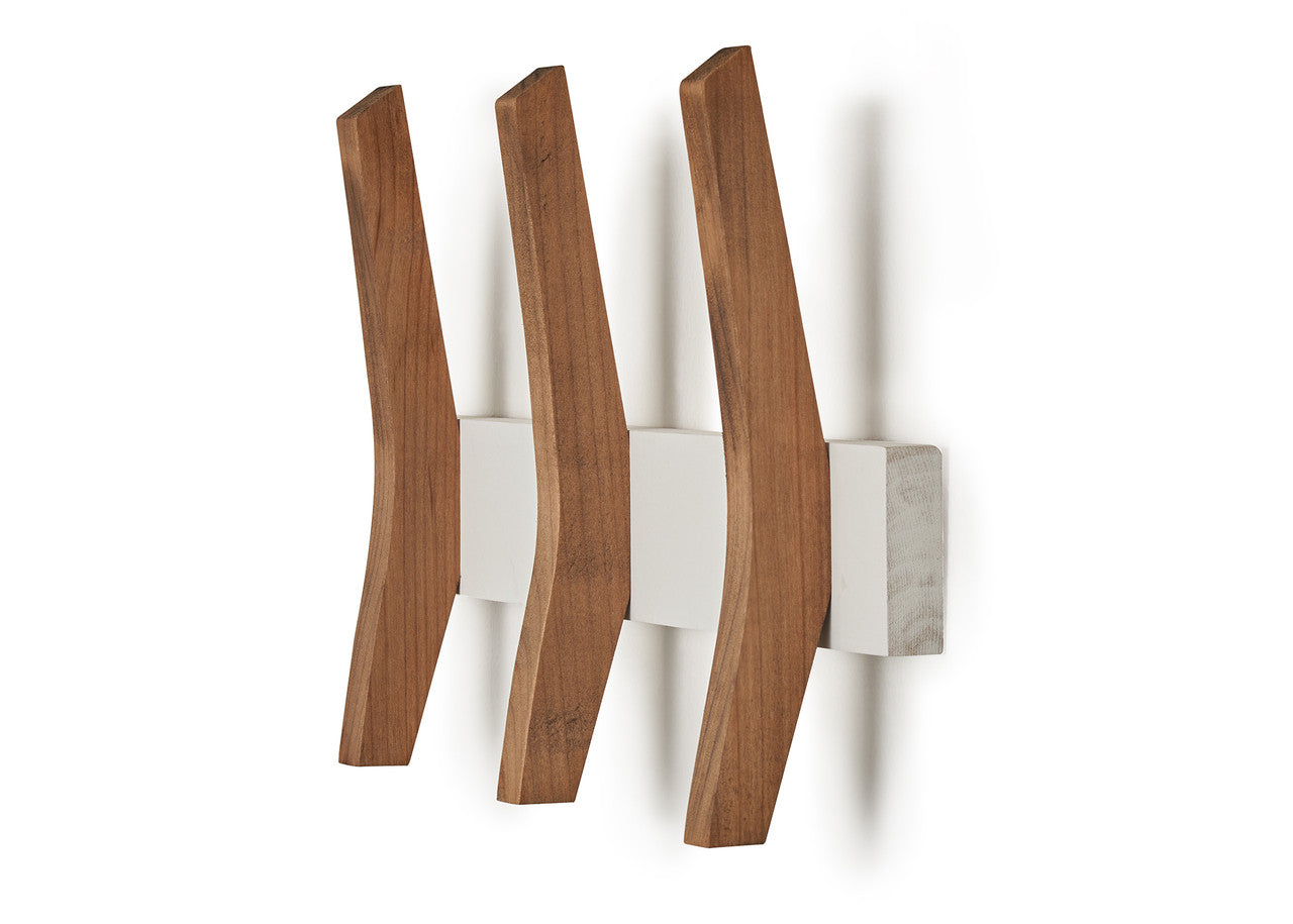 Three curved wooden hooks extend horizontally from a rectangular white and gray speckled base mounted on a white wall. The hooks are evenly spaced and angled slightly upwards.