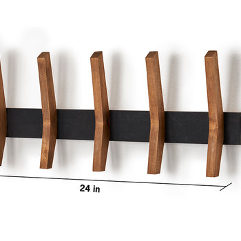 A horizontal, wall-mounted coat rack features five evenly spaced wooden pegs angled slightly upward and attached to a rectangular black backplate. The dimensions shown indicate the rack is 24 inches wide and 9.5 inches tall, with the pegs extending 2.25 inches from the wall.