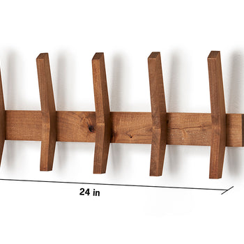 A wooden mid-century coat rack with five angled wooden hooks is mounted on a white wall. The rack is 24 inches wide and 9.5 inches tall, with each hook extending 2.25 inches from the base.