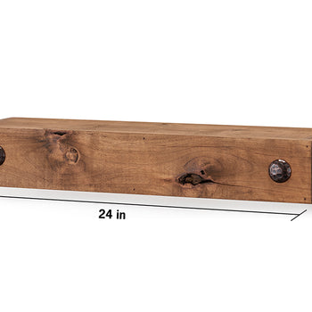 A rectangular wooden floating shelf is shown against a white background. The shelf is 24 inches long, 4 inches high, and 6.625 inches deep, and features two decorative dark metal clavos on the front.