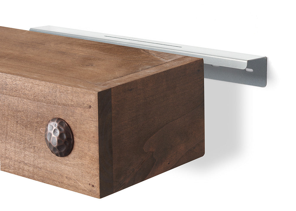 Detailed view of a floating shelf mounting system, showcasing a metal bracket and a rustic wood shelf component. A dark, hammered metal embellishment is visible on the shelf's side.