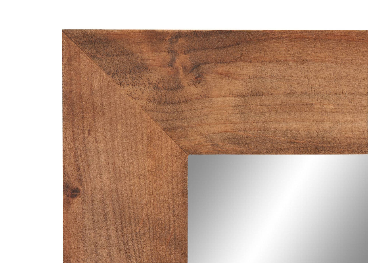 Detailed shot of the craftsmanship of a farmhouse vanity mirror. The image highlights the joinery of the wooden frame and the smooth surface of the mirror glass.