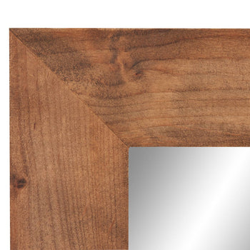 Detailed shot of the craftsmanship of a farmhouse vanity mirror. The image highlights the joinery of the wooden frame and the smooth surface of the mirror glass.
