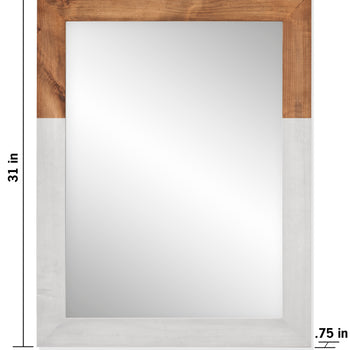 A rectangular wall mirror features a two-tone frame, with the top section in a natural wood finish and the bottom and side sections in a distressed white finish. The mirror measures 31 inches high by 24 inches wide, with a frame thickness of 0.75 inches.