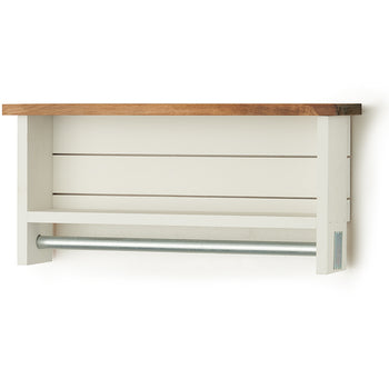 A white wooden towel bar with two shelves and a natural wood top is mounted on a white wall. The towel bar is a silver metal rod extending horizontally beneath the lower shelf.