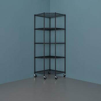 A five-tier, black wire corner shelving unit with casters sits against a deep blue wall in a room with a gray floor. The shelves are wide at the back and taper to a point in the front, fitting neatly into the corner.