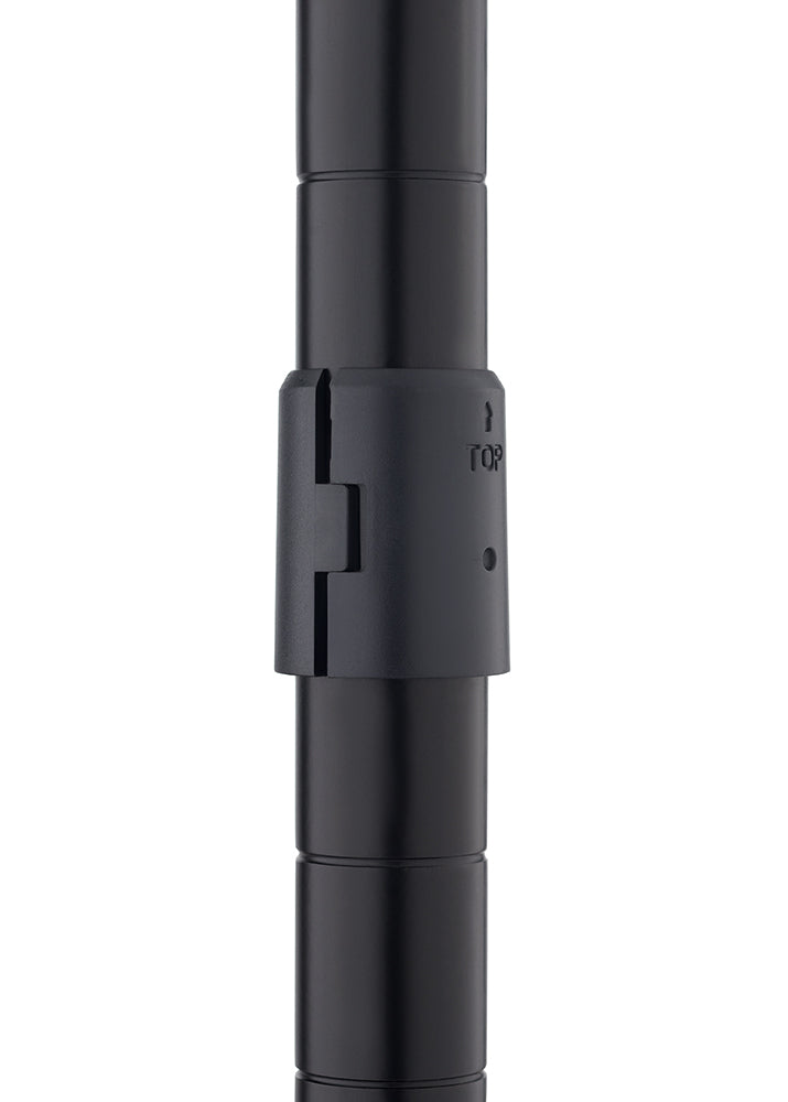 A close-up photograph shows two black metal shelving pole segments joined together by a black plastic pole connector or sleeve. The connector has an embossed arrow and the word "TOP" indicating the proper orientation for assembly.