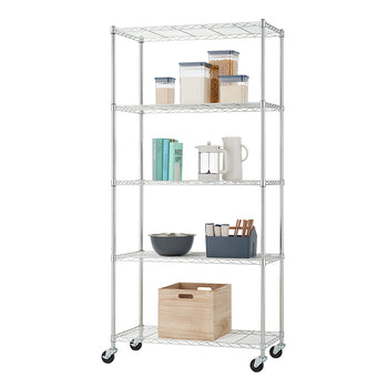 A tall, chrome wire shelving unit with five adjustable shelves is pictured, standing on caster wheels. The shelves are organized with various kitchen and pantry items, including clear airtight containers for dry goods, books, a French press, a pitcher, a mixing bowl, an organizer for utensils, and a wooden storage box.