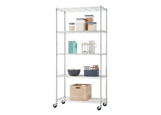 A tall, chrome wire shelving unit with five adjustable shelves is pictured, standing on caster wheels. The shelves are organized with various kitchen and pantry items, including clear airtight containers for dry goods, books, a French press, a pitcher, a mixing bowl, an organizer for utensils, and a wooden storage box.