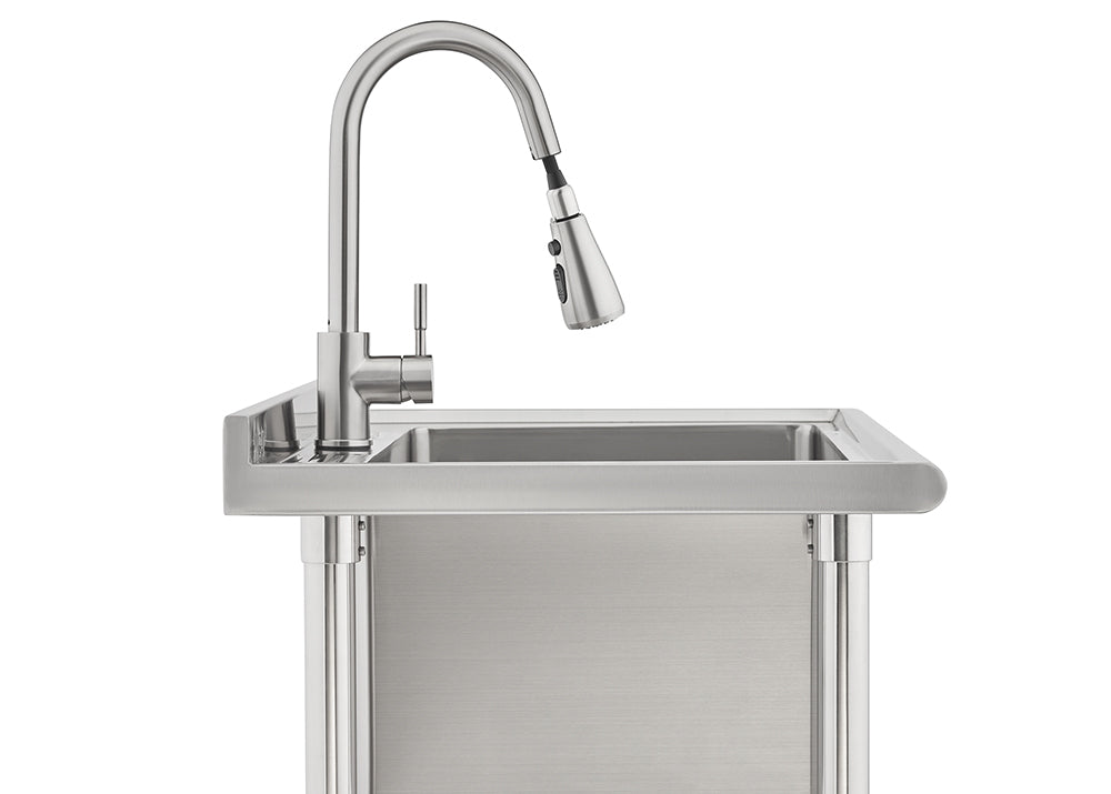 A modern stainless steel utility sink features a high-arc gooseneck faucet with a pull-down sprayer head. The sink unit has straight sides, exposed tubular legs, and a brushed metal finish, suggesting an industrial or outdoor application.