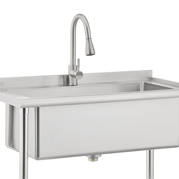 A stainless steel commercial utility sink is shown with a deep basin and a high-arc gooseneck faucet. The sink is mounted on four metal legs and features a small backsplash with the word 'NEAT' subtly visible on the left side.