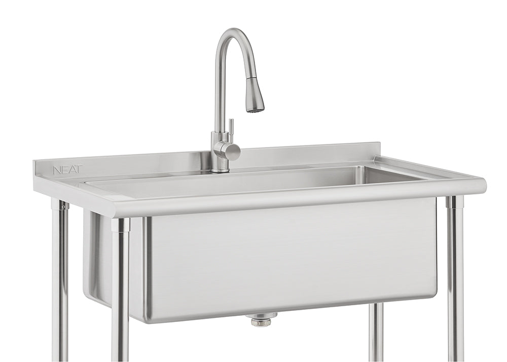 A stainless steel commercial utility sink is shown with a deep basin and a high-arc gooseneck faucet. The sink is mounted on four metal legs and features a small backsplash with the word 'NEAT' subtly visible on the left side.