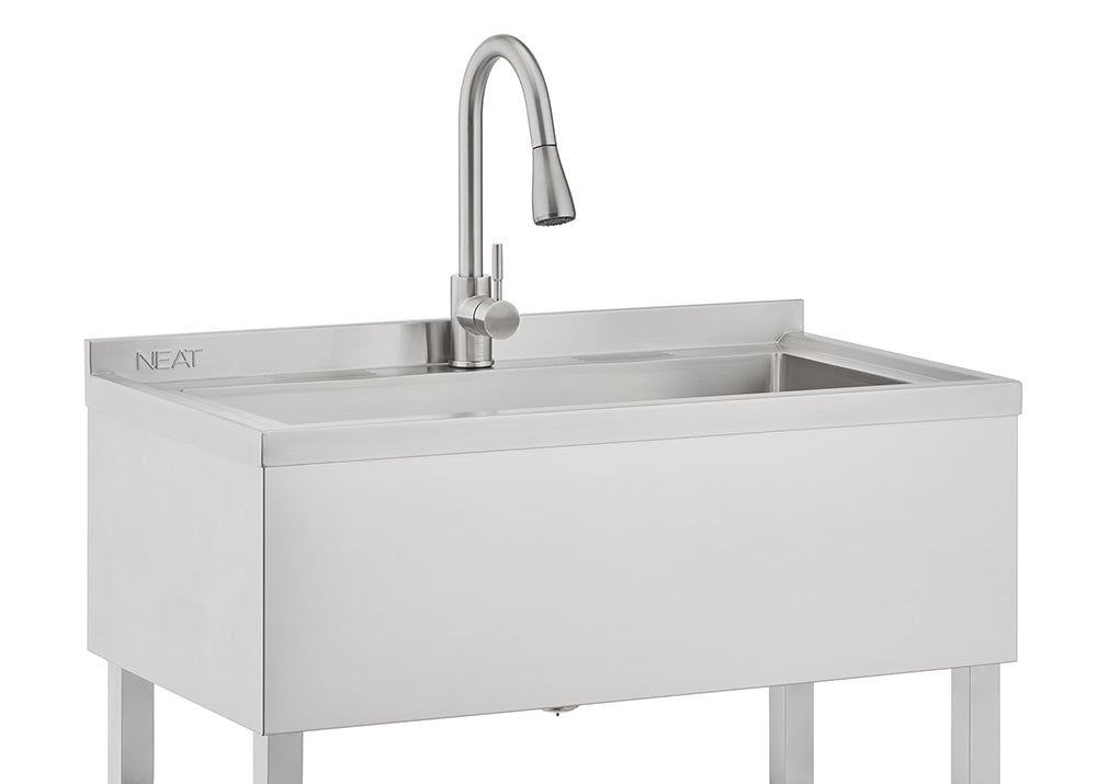 A close-up photograph features a stainless steel utility sink with a built-in gooseneck faucet that has a pull-down sprayer head. The sink has a modern, rectangular basin and is supported by visible metal legs, suggesting a laundry or garage utility setup.
