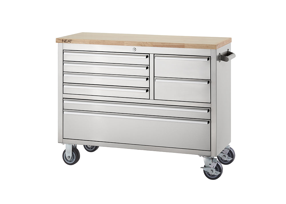 A stainless steel mobile tool workbench featuring a solid light wood top and heavy-duty swivel casters against a plain white background. All drawers are closed, and the top surface is clean and clear.