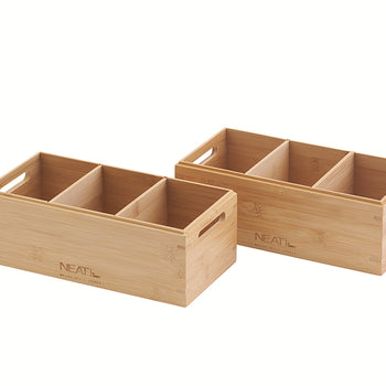 A pair of natural wood organizer bins are displayed against a white background, each featuring four compartments to keep items separated and organized. These rectangular bins include built-in side handles for easy carrying and are branded with the word "NEAT" and other text.