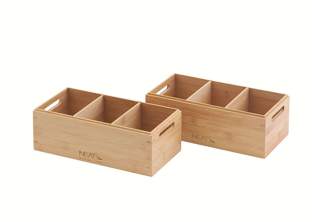 A pair of natural wood organizer bins are displayed against a white background, each featuring four compartments to keep items separated and organized. These rectangular bins include built-in side handles for easy carrying and are branded with the word "NEAT" and other text.