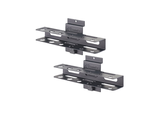 A pair of dark gray, metallic wall-mounted storage brackets are shown, each featuring multiple circular openings on the top and bottom surfaces for organizing tools or accessories. The brackets are branded with the TRINITY logo and appear designed to hang on a slatwall or similar system.