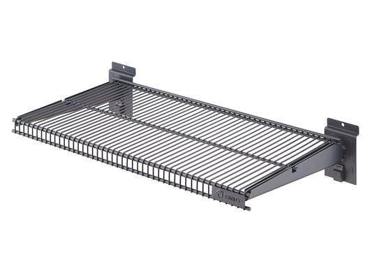 A close-up image shows a dark gray, wire-mesh shelf with a metal frame, designed for wall mounting. The shelf is wide and shallow, with two integrated brackets on either end for attachment.