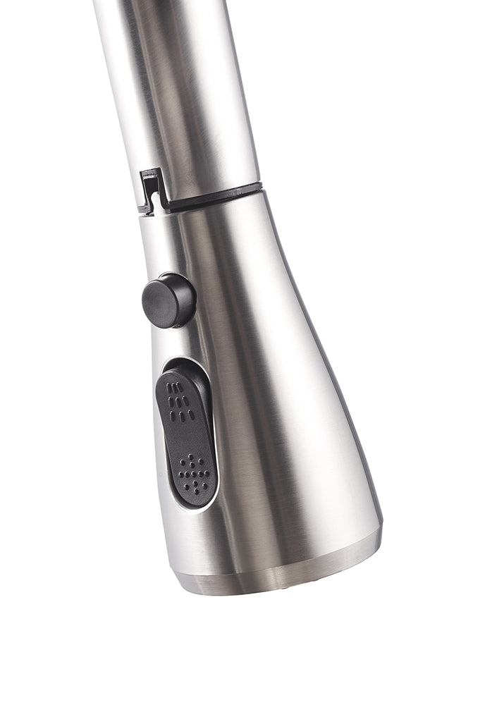 A close-up photograph shows the brushed stainless steel sprayer head of a kitchen faucet. It features a black, rubberized toggle switch for spray pattern selection and a small, round black button above it, likely for a pause or boost function.