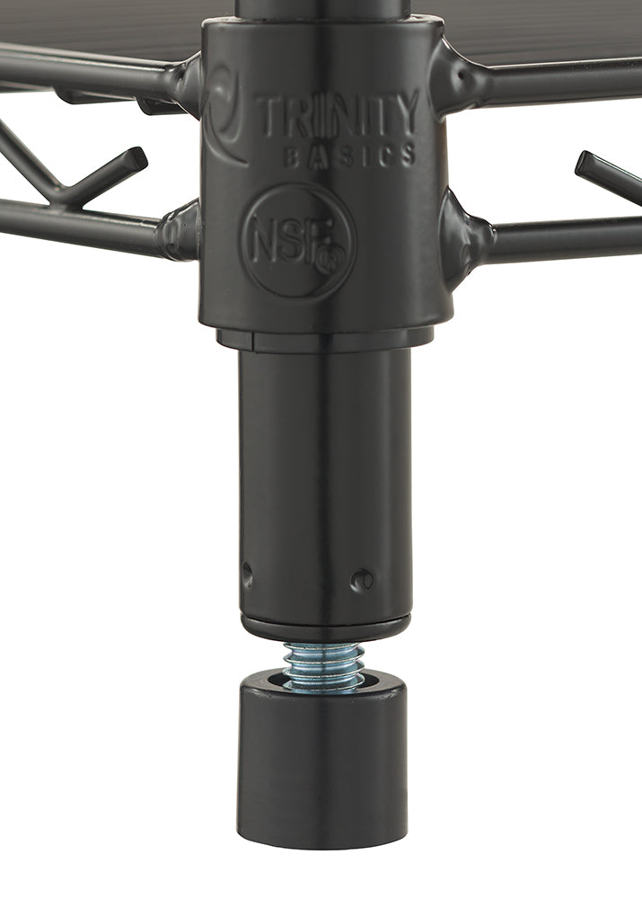 A close-up photograph displays the adjustable leveler foot of a black metal wire shelving unit. The pole joint features embossed logos for "TRINITY BASICS" and the NSF certification mark.