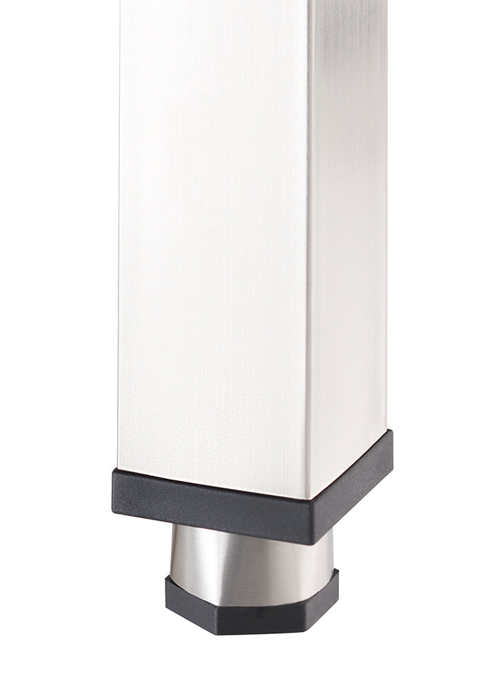 A close-up photograph shows the bottom of a square, brushed-metal furniture leg with a black plastic trim. The leg features a smaller, cylindrical adjustable foot at the base with a hexagonal black rubber grip for stability.
