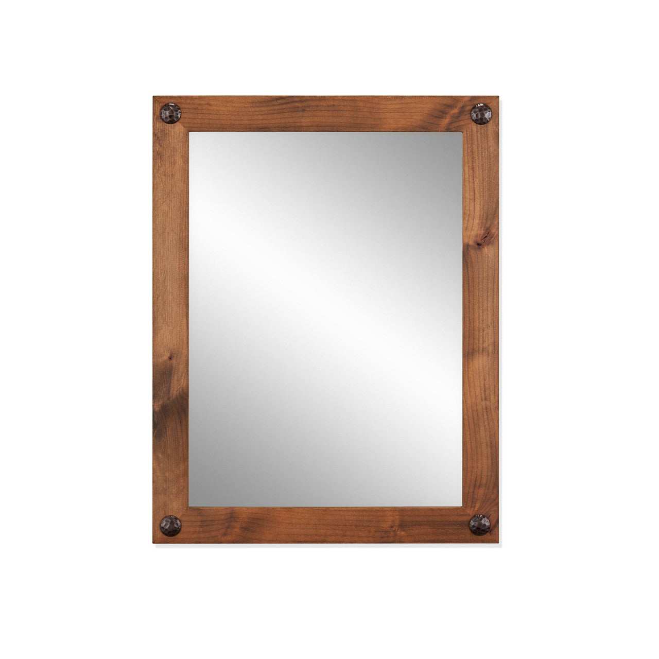 A rectangular farmhouse vanity mirror with a walnut frame and decorative clavos in each corner. The mirror reflects a slightly lighter area in the center.