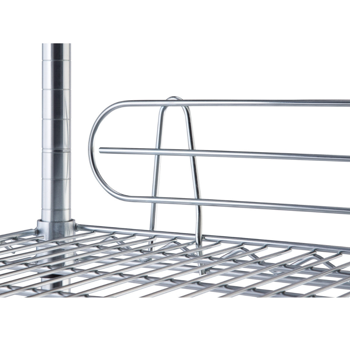 A close-up shot shows a chrome wire shelf with a rounded, two-bar wire ledge attached to its back edge. The ledge is designed to prevent items from falling off the back of the shelf.