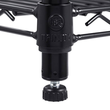 Close-up view of the black metal leg of a Trinity shelving unit. The leg features the 