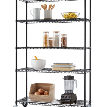 A black five-tier wire shelving unit on caster wheels is neatly organized with various kitchen and pantry essentials set against a white background. The shelves feature wooden utensils, glass storage jars, food prep containers, a countertop blender, and an open wooden crate filled with onions.