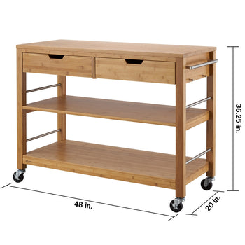 A light-colored bamboo kitchen island with two drawers and two open shelves is shown from a slightly elevated angle. The island has silver-toned handles on the drawers and two towel bars on the sides, and it stands on four caster wheels. Its dimensions are 48 inch wide by 20 inch deep by 36.25 inch in height.