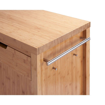 A close-up shows the corner of a light-colored bamboo kitchen island or cabinet. A stainless steel towel bar is attached to the side, along with two small pegs below it.