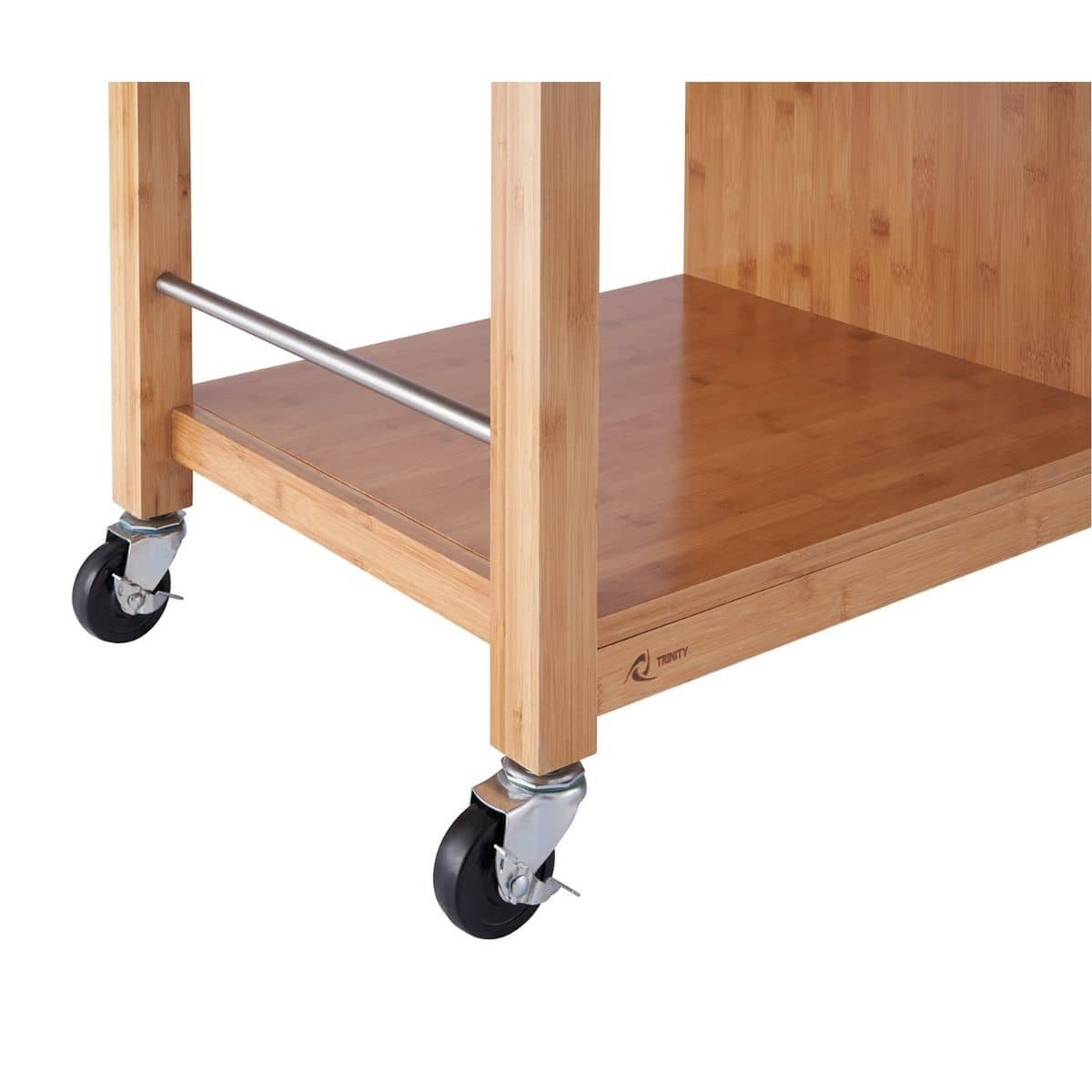 A close-up shows the bottom corner of a light brown bamboo kitchen island or cart. It features two black caster wheels with silver hardware and a lower shelf made of the same bamboo material, supported by cylindrical legs and a horizontal silver bar.