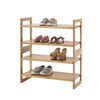 A four-tiered bamboo shoe rack stands against a white background, displaying various pairs of shoes. The rack holds sneakers on the top shelf, flats and sandals on the middle shelf, heeled sandals on the shelf above the bottom, and casual shoes on the bottom shelf.
