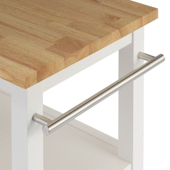 A close-up shot of the corner of a kitchen cart shows a light wood butcher block countertop over a white frame. A horizontal silver-toned metal bar, likely a towel rack, is attached to the side of the white frame.
