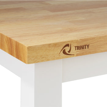 A close-up shot of the corner of a Trinity Kitchen Cart reveals a light-colored, butcher block-style countertop with the 