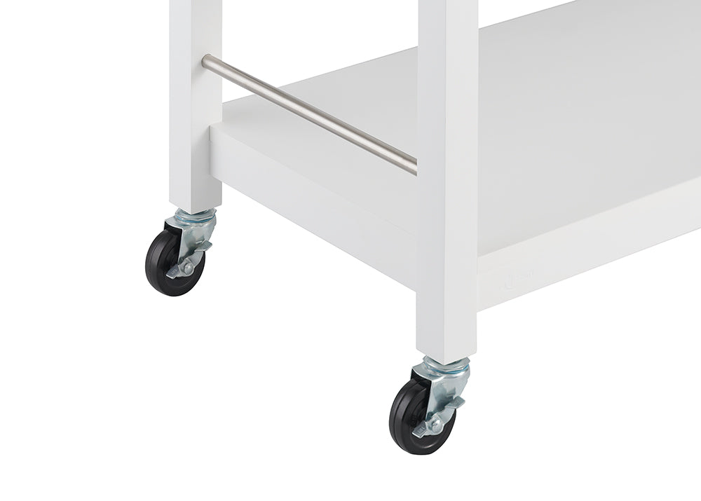 A close-up shot of the lower section of a white kitchen cart with two black wheels visible on the left and right. A silver bar extends horizontally between the two white legs of the cart, just above the lower shelf.