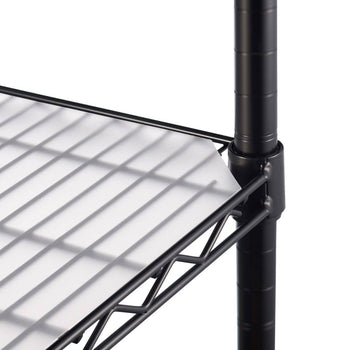 A close-up shot of a pre cut corner edge of the white, translucent shelf liner placed on a black wire shelving unit. The liner is slightly frosted and extends to the edge of the shelf, with the wire rack visible underneath.