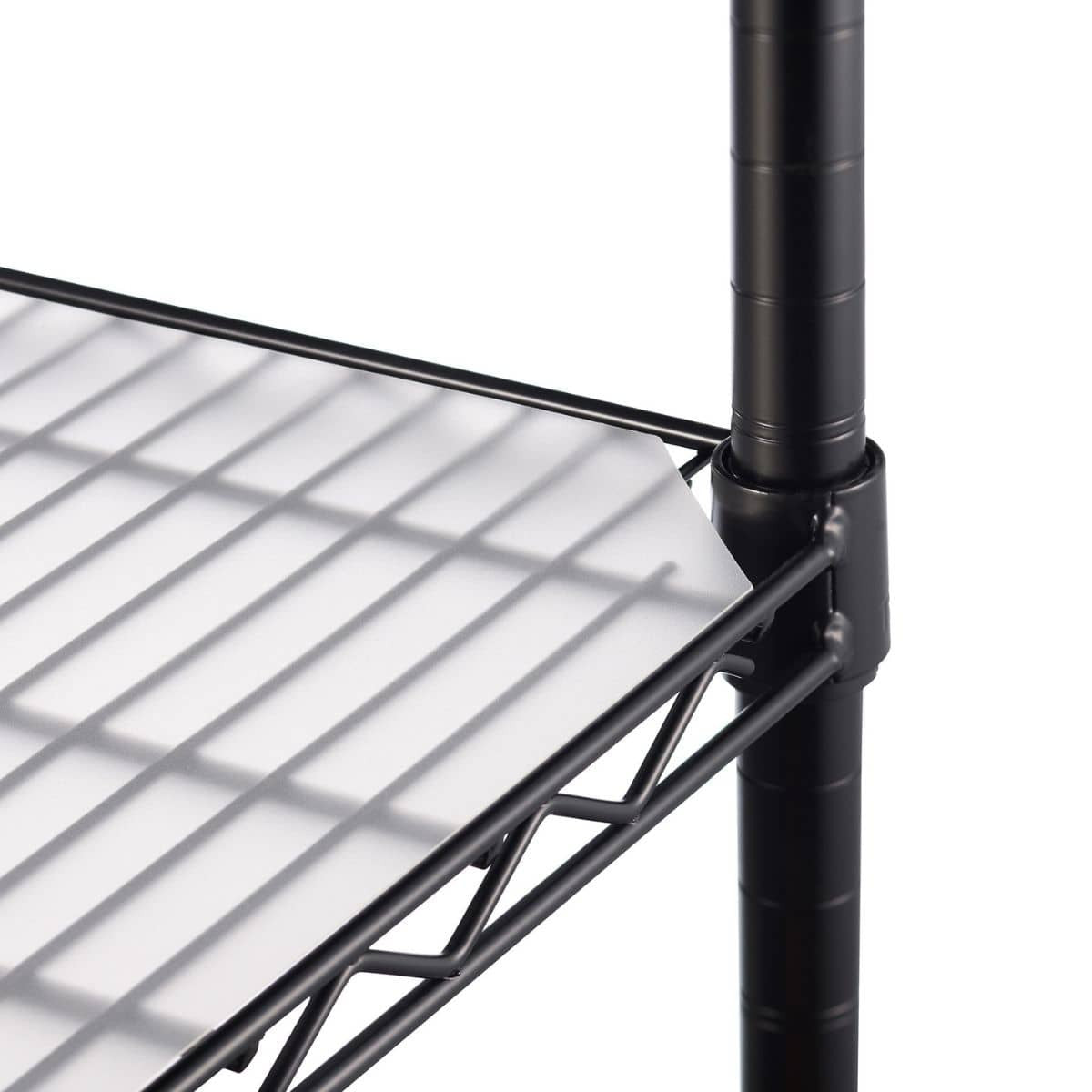 A close-up shot of a pre cut corner edge of the white, translucent shelf liner placed on a black wire shelving unit. The liner is slightly frosted and extends to the edge of the shelf, with the wire rack visible underneath.