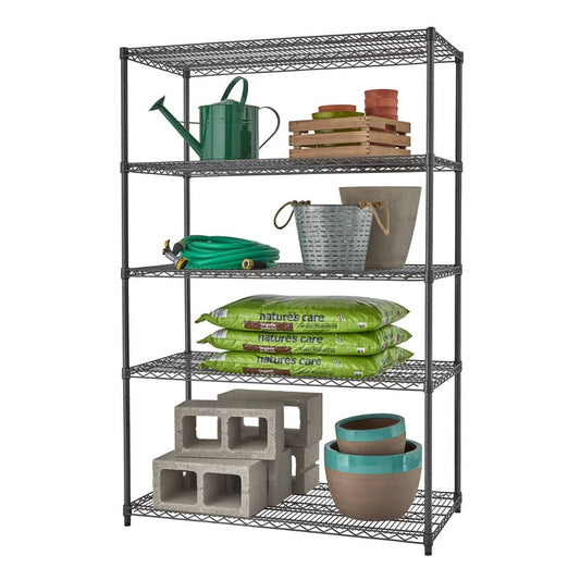 A black anthracite textured wire shelving unit with five tiers stands against a white background. The shelves hold gardening items like water can, clay pots, hoses, pail, soil sacks, and cinder blocks.