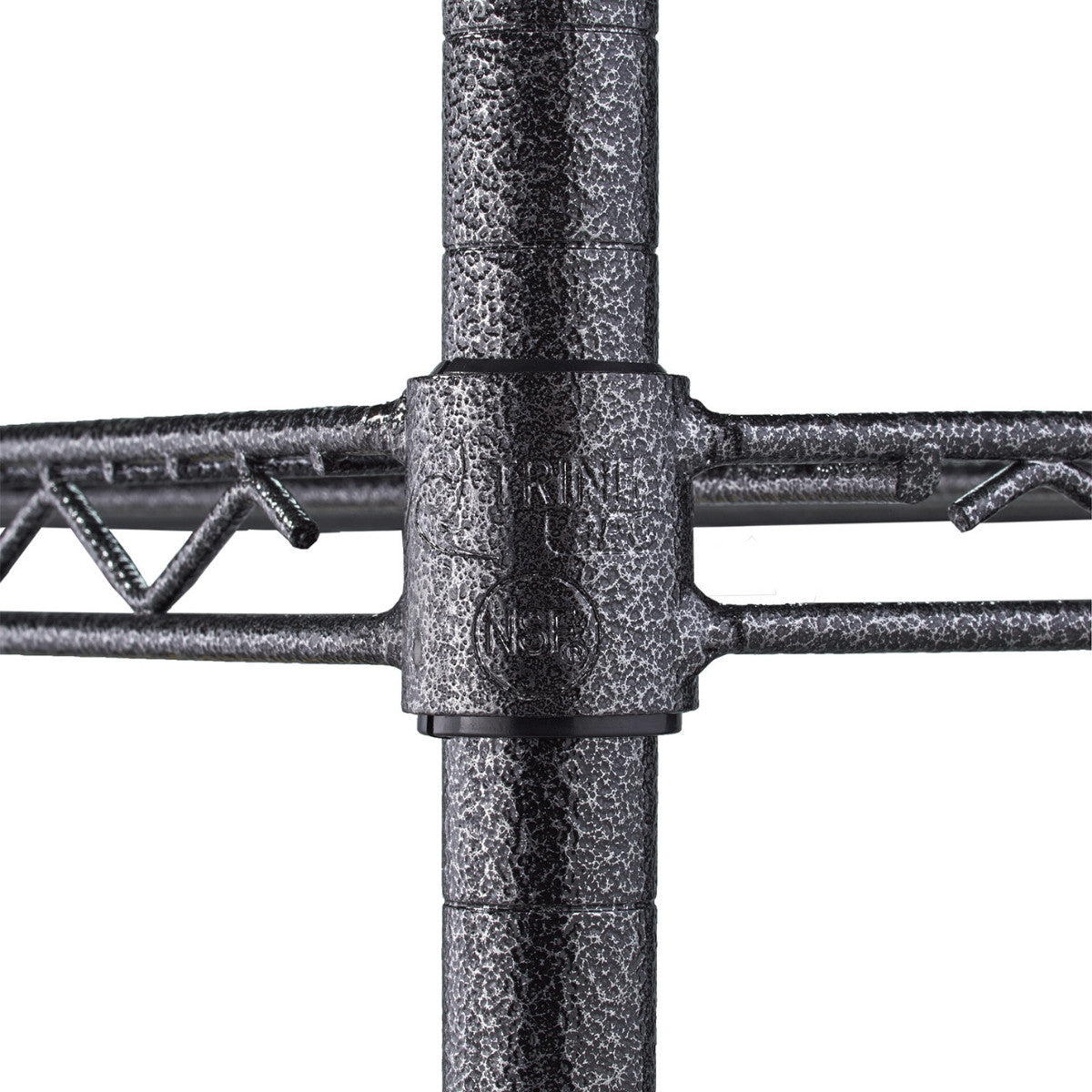 A close-up shows the textured, dark grey metal pole of a wire shelving unit, where a horizontal shelf support connects to the vertical pole using a black plastic sleeve. The sleeve has some embossed text, and the wire shelf extends to the left and right.