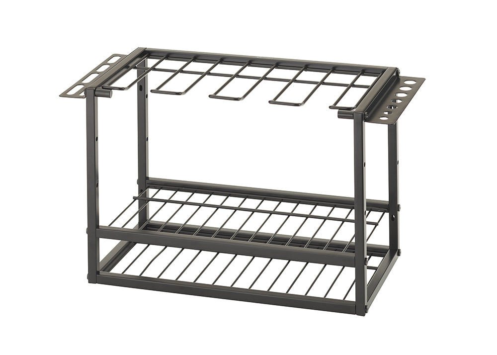 A close-up shot of a black metal tool organizer against a white background. It has two tiers: a bottom shelf with a grid pattern and an upper rack for hanging tools, along with side compartments for screwdrivers and other small implements.